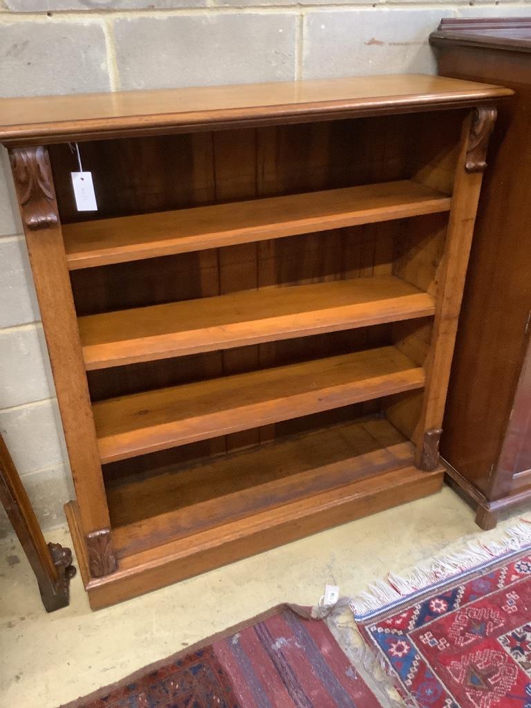 A Victorian faded mahogany open bookcase, width 112cm, depth 34cm, height 121cm